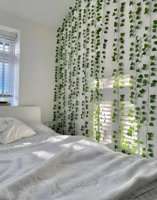 Artificial ivy vine leaves hanging on aesthetic bedroom wall decor setup