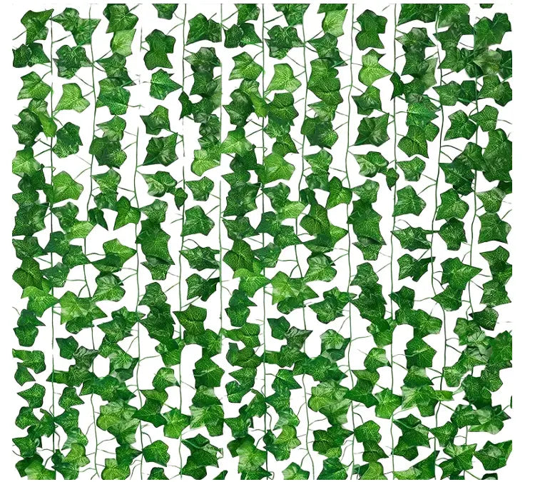 Artificial ivy vine leaves hanging on aesthetic bedroom wall decor setup
